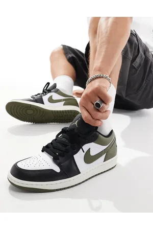 Jordan Nike Air 1 Low trainers in white, and black