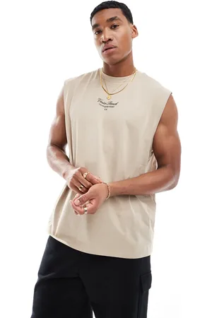 ASOS Relaxed vest in beige with text chest print