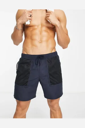 ASOS Swim shorts in mid length with mesh pockets in navy