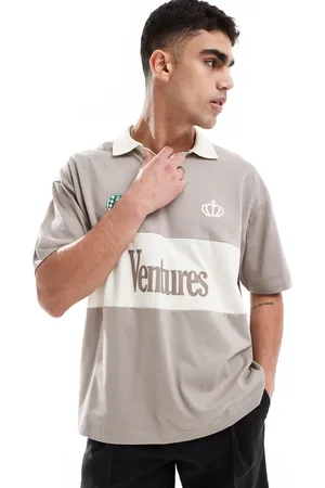 ASOS Oversized polo with cut and sew panelling and text graphic in