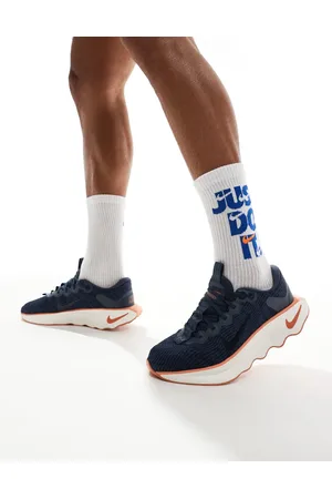 Nike Motiva trainers in and orange