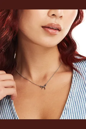 LOST SOULS Stainless steel bow pendant necklace in