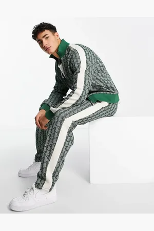 Lacoste All over print taped track bottoms in
