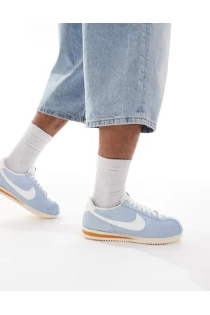 Nike Cortez trainers in sail and orange
