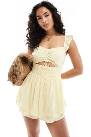 Hollister Flutter sleeve cutout playsuit in lemon polka dot