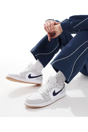 Jordan Nike Air 1 Low trainers in white and navy