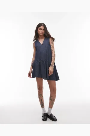 Topshop Denim mini dress with peplum hem and bow detail in raw look indigo