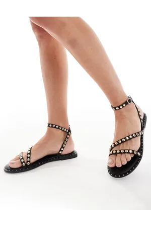 SEQWL Flat sandals with studded staps in black