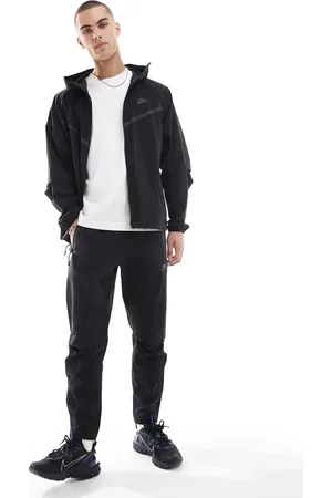 Nike Tech Woven open hem trousers in