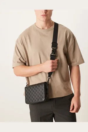 ASOS Crossbody bag with monogram emboss detail in faux leather