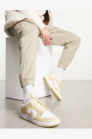 Nike Dunk Low Retro trainers In gold and