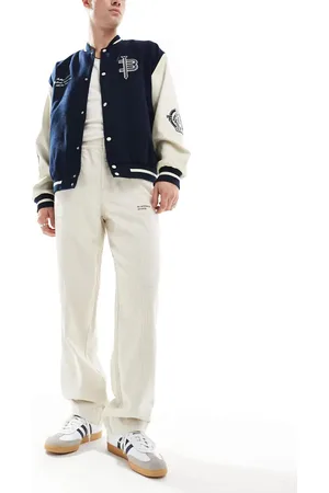 ASOS Baggy cord trousers with embroidered patch in stone