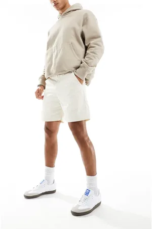 adidas Woven chino shorts in off