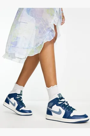 Jordan Nike Air 1 Mid trainers in navy and white