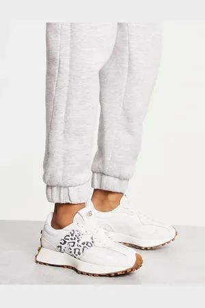 New Balance 327 trainers in off with leopard print detail