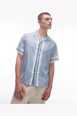 Lacoste Short sleeve revere collared shirt in and white all over monogram print