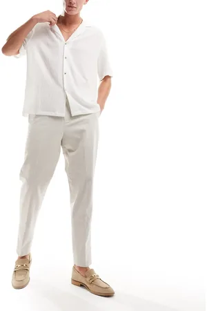 Harry Brown High waisted pleated linen trousers in ecru