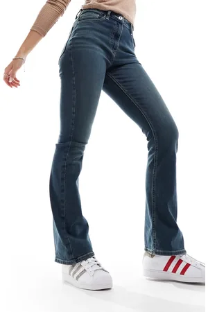 COLLUSION X007 stretch flare jeans in midwash