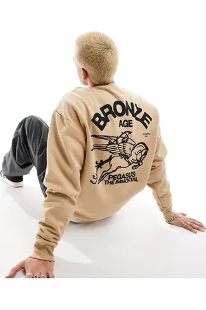ASOS Oversized sweatshirt in beige with mythic back print