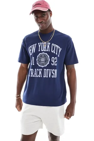 Cotton On Cotton On loose fit college t-shirt with NY track graphic indigo