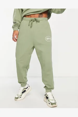 ASOS ASOS Dark Future co-ord relaxed joggers with v-neck and piping in khaki