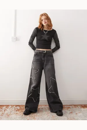 Minga London washed distressed baggy jeans with star graphic in