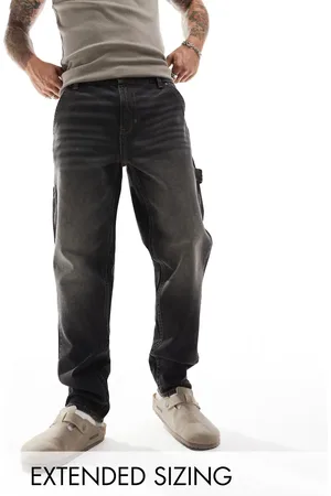 ASOS Tapered fit jeans with carpenter detail in washed