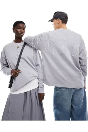 ASOS Oversized sweatshirt in washed with large scale embroidery