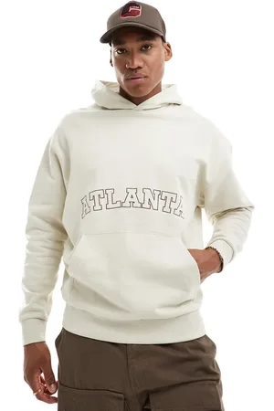 ASOS Oversized hoodie in beige with front city embroidery print