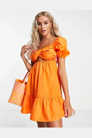 The Frolic Mini babydoll smock dress with contrast tie back in