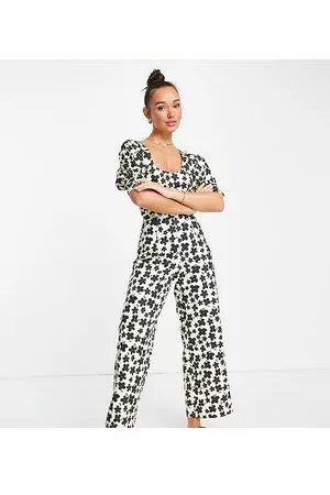 Lost Ink Puff sleeve waist detail jumpsuit with tie neck in multi floral