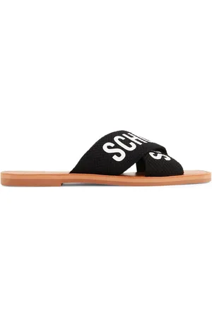 Schutz Logo-print flat leather slides