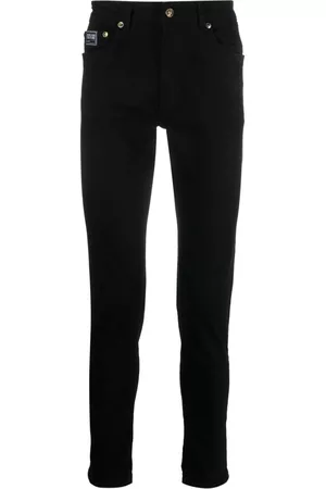 VERSACE Men Relaxed fit trousers - Logo-patch cotton trousers