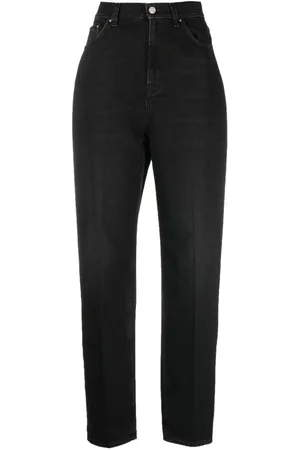 Totême Faded-effect tapered-leg jeans
