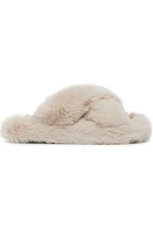 White fluffy cross online over slippers