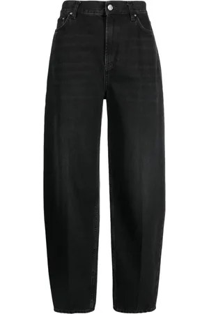 Totême Faded-effect tapered-leg jeans