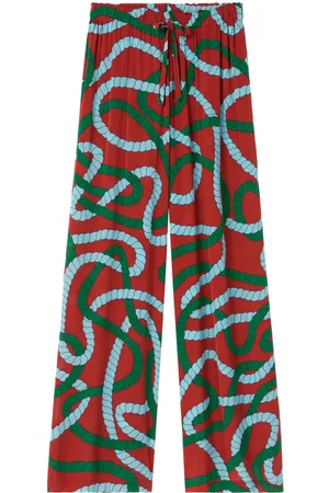 Mens AMIRI red Tapestry Print Flared Trousers | Harrods # {CountryCode}