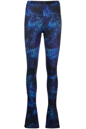 OFF-WHITE All-over logo-print flared trousers