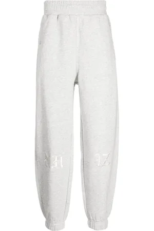 Izzue High-waisted logo-patch tapered track pants