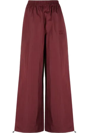 ROTATE Logo-embroidered elasticated-waist palazzo trousers