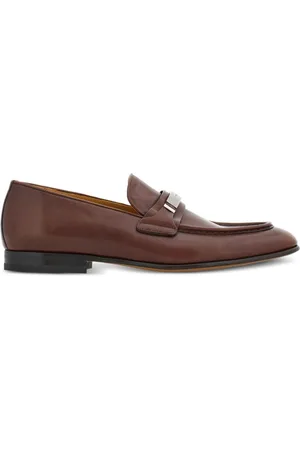 Salvatore Ferragamo Logo-engraved leather loafers