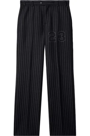 OFF-WHITE Number-print pinstriped slim-cut trousers
