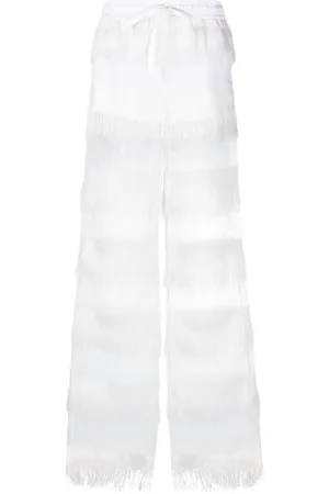 GENNY Semi-sheer fringed trousers