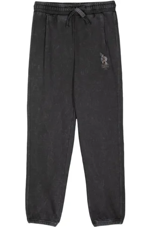 Musium Div. Drawstring logo-print trousers