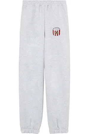 JOSHUA SANDERS Motif-embroidered tracn pants