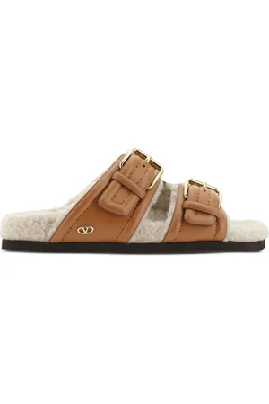 VALENTINO GARAVANI Buckled shearling slides
