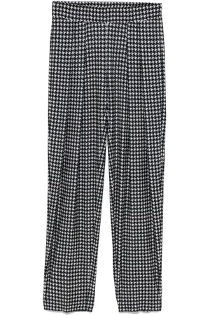 Norma Kamali Pleated low-rise trousers