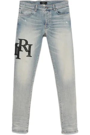 AMIRI Staggered-logo jeans