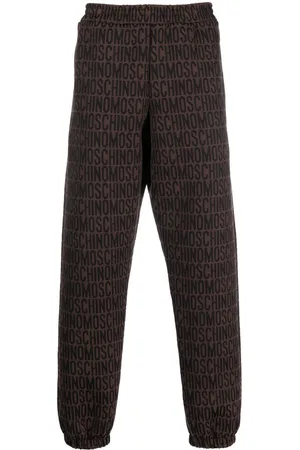 Moschino All-over embroidered logo track pants