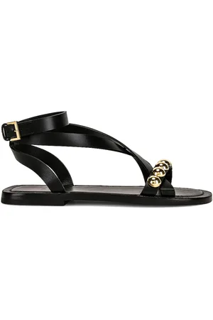 Alaïa Flat Ankle Strap Sandals in Black